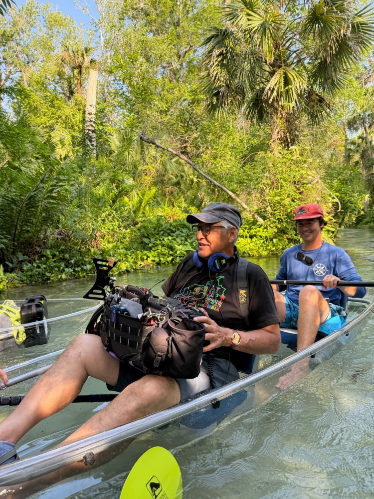 a group of people riding on the back of a boat