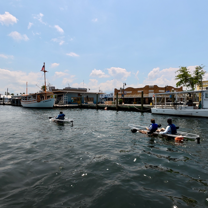 a group of people in a boat on a body of water
