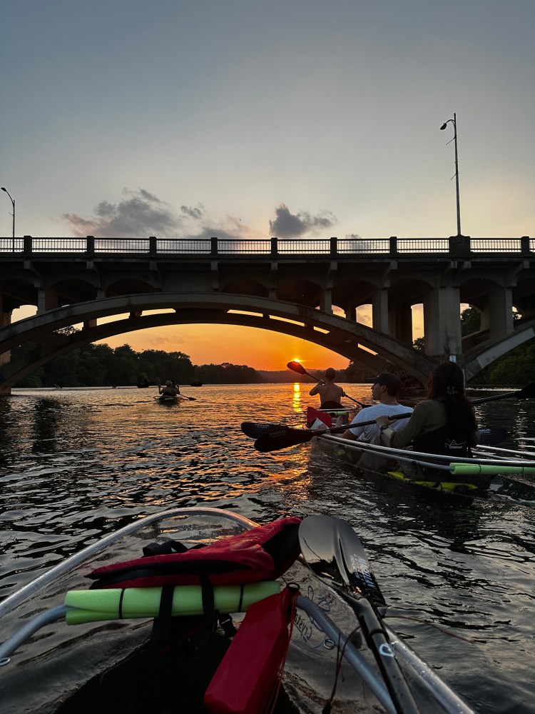 a train crossing a bridge over a body of water