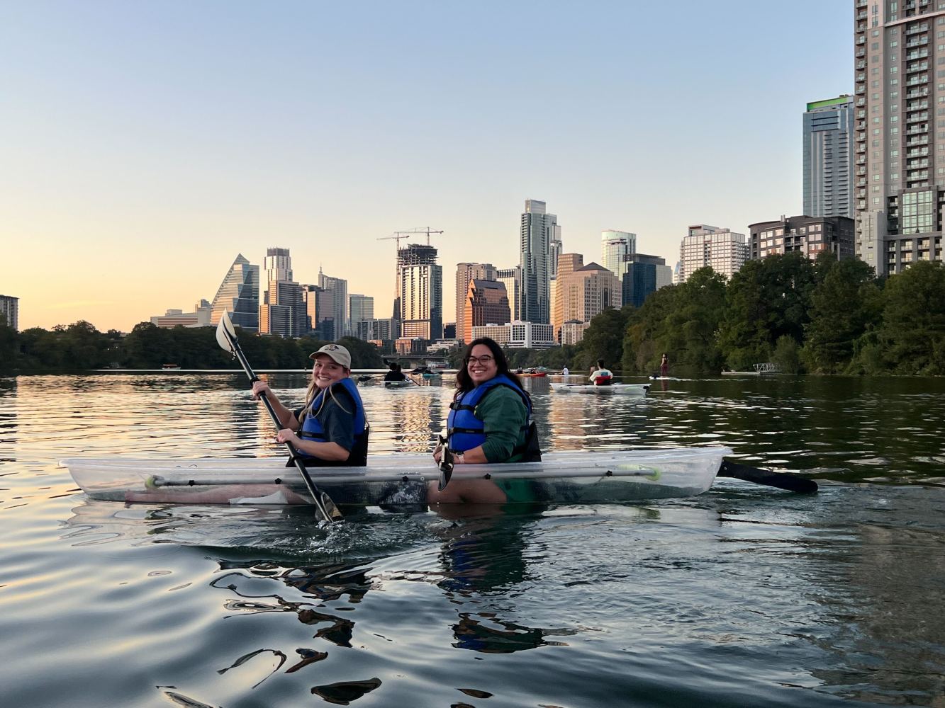 a body of water with a city in the background