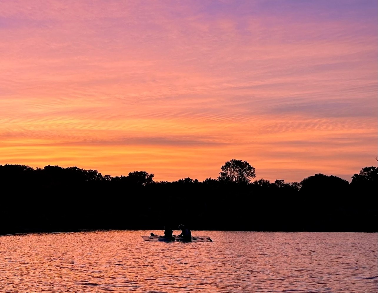 a sunset over a body of water