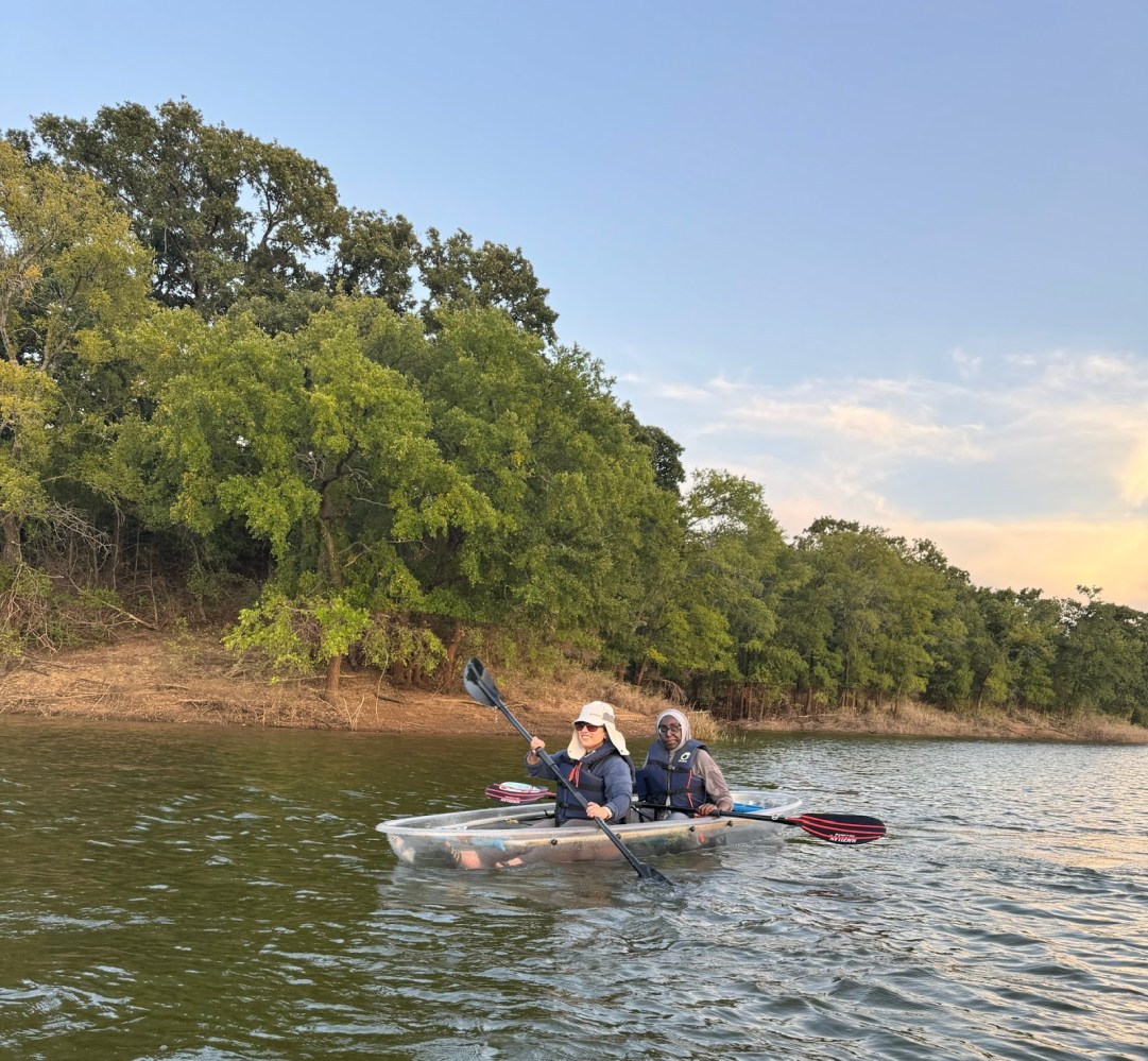 a man rowing a boat in a body of water