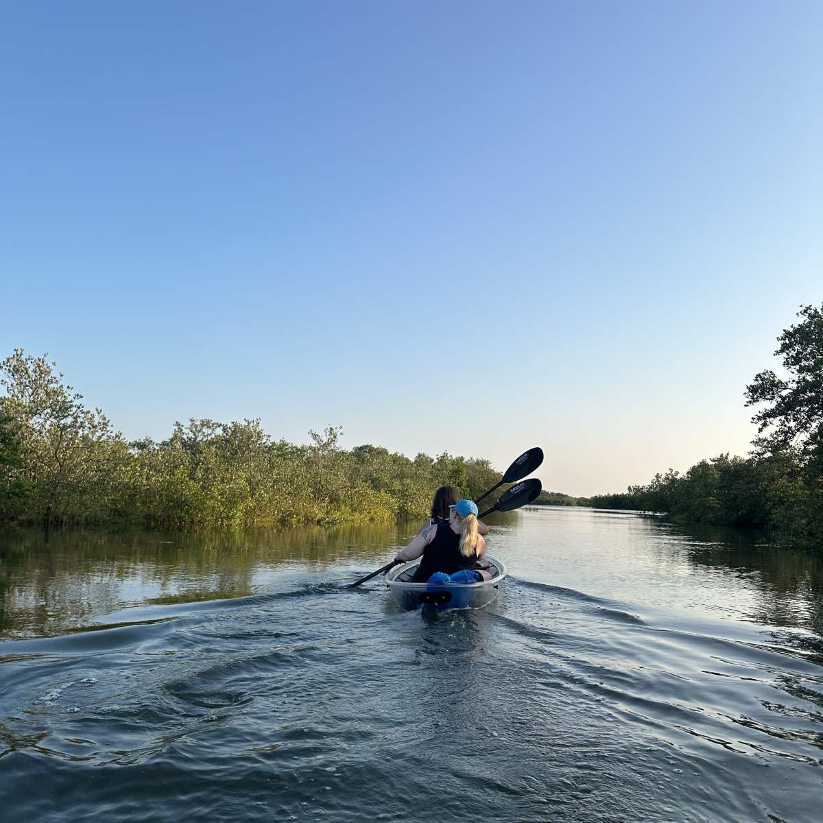 a man riding a motorcycle in the water