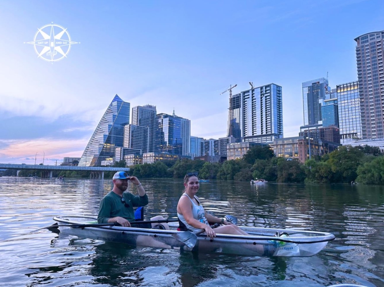 a group of people rowing a boat in the water