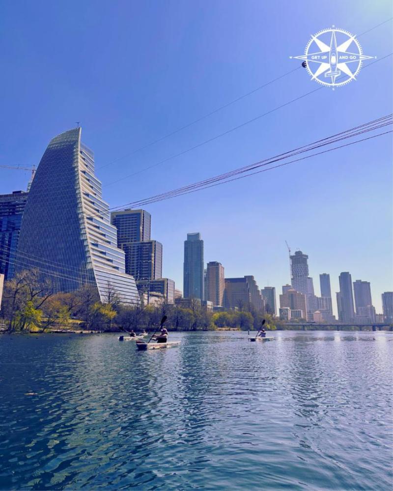a large body of water with a city in the background
