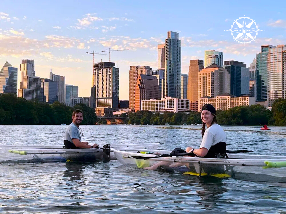 a group of people rowing a boat in the water