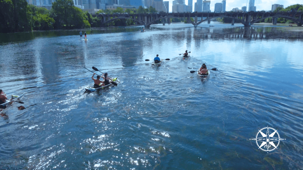 a group of people swimming in a body of water
