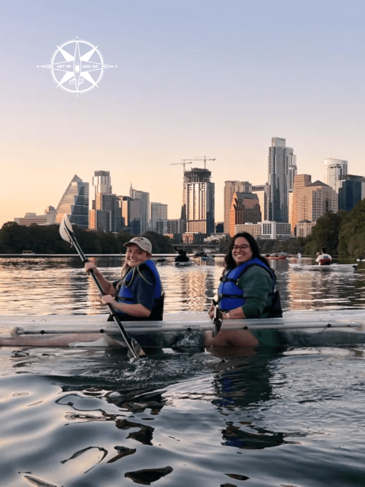 a body of water with a city in the background