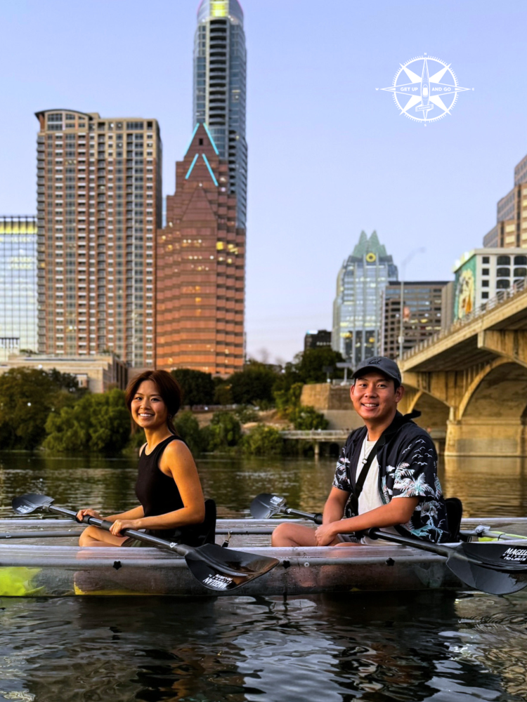 a group of people rowing a boat in the water