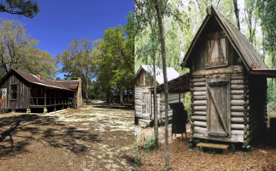 Two rustic wooden cabins in a wooded area under a clear blue sky.