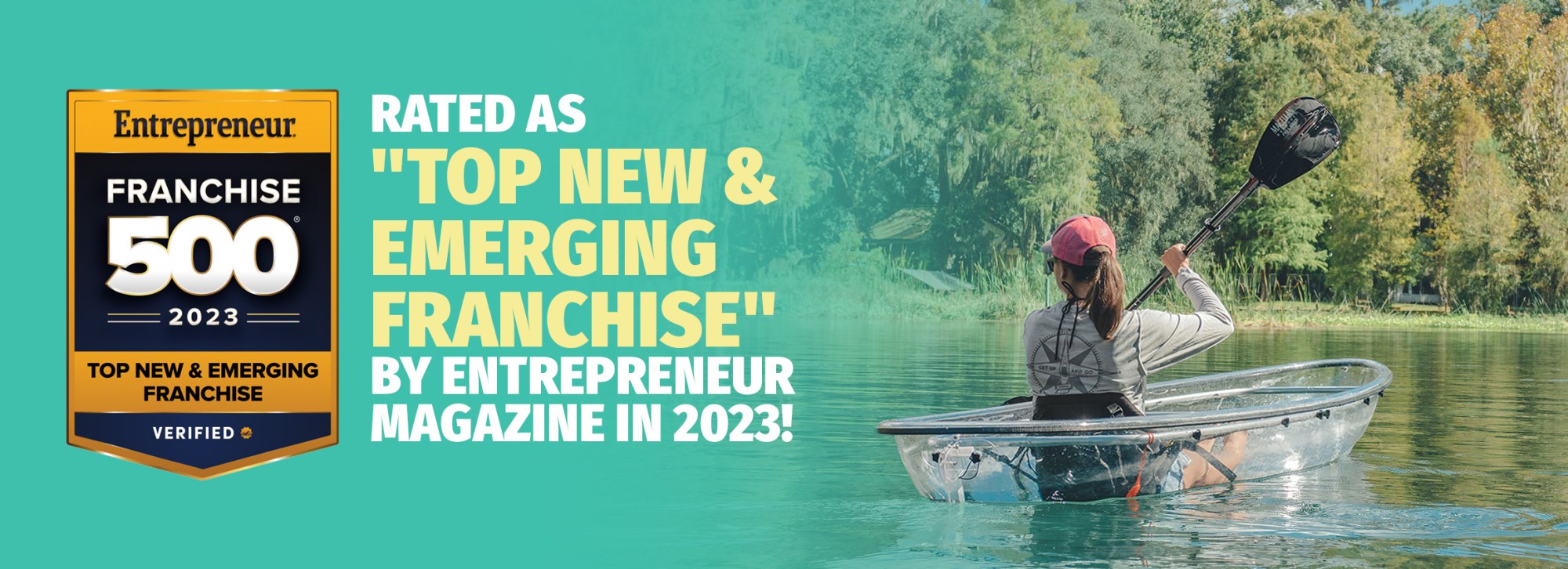 Person kayaking in clear kayak on a lake; text about Entrepreneur Franchise 500 ranking in 2023.
