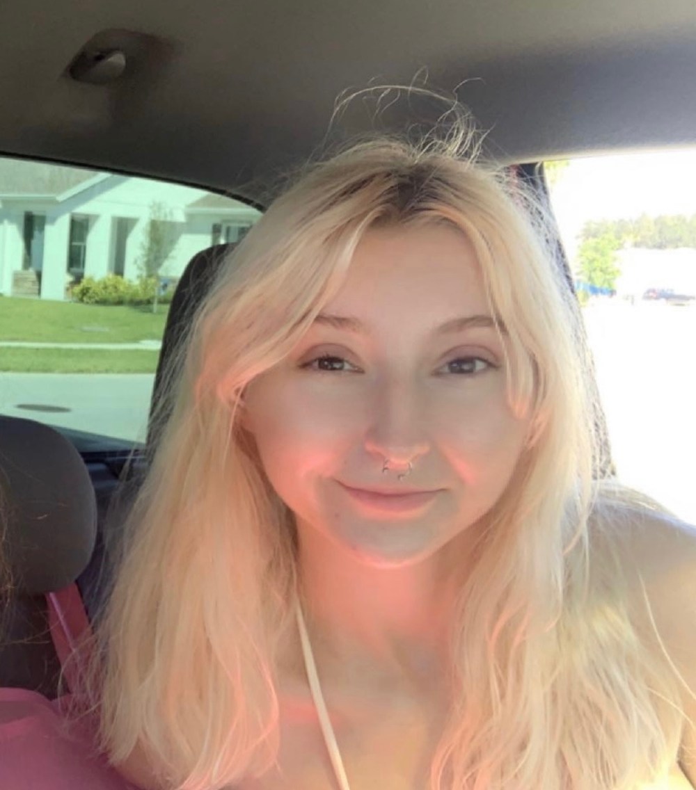 a man standing next to a body of water