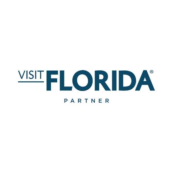 Visit Florida Partner logo in blue text on white background.