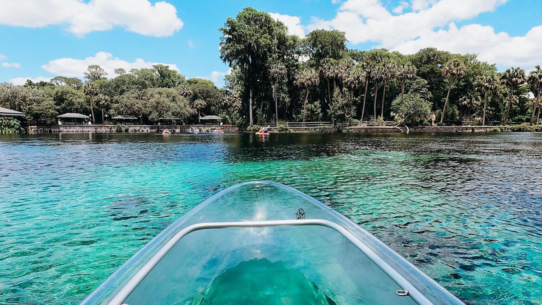 View from a clear kayak across turquoise water at Silver Springs